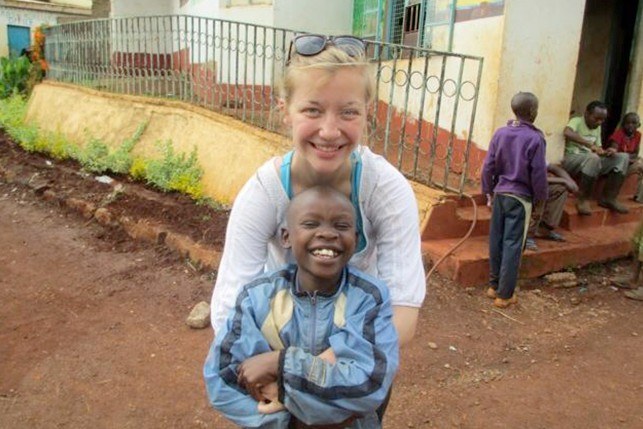 Community, Environment, and Development student with a local child at the Children and Youth Empowerment Center (CYEC) in Kenya.